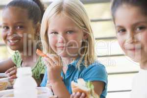 Kindergarten children eating lunch
