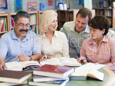 Mature students studying in library