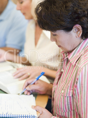 Mature students studying in library