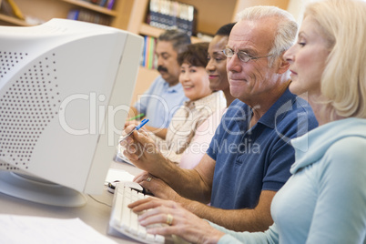 Mature students learning computer skills