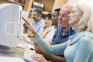 Mature students learning computer skills