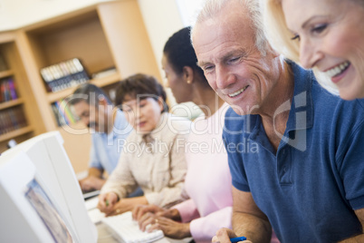 Mature students learning computer skills