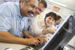 Mature students learning computer skills