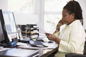 Woman in home office using computer