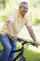 Man on bike outdoors smiling