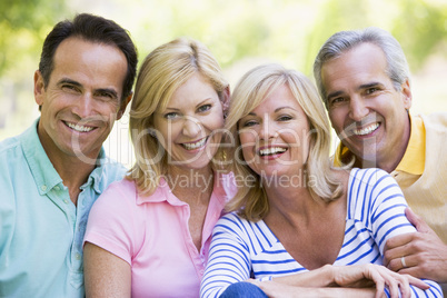 Two couples outdoors smiling