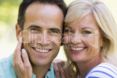 Couple outdoors smiling