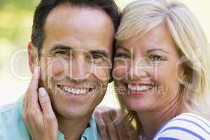 Couple outdoors smiling