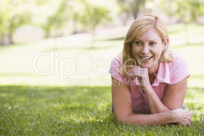 Woman relaxing outdoors smiling