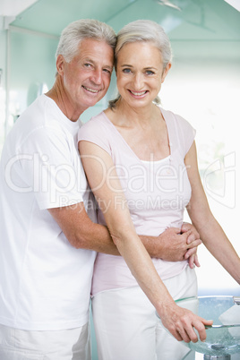 Couple embracing at a spa and smiling