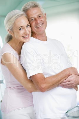 Couple embracing at a spa and smiling