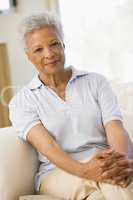 Woman sitting in living room