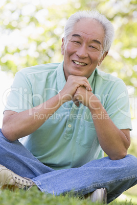 Man sitting outdoors smiling