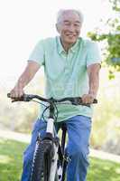 Man on bike outdoors smiling