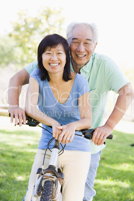 Mature couple bike riding.