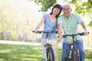 Mature couple bike riding.