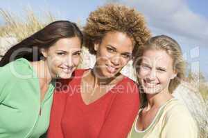 Group of three female friends at beach