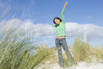 Young woman amongst dunes