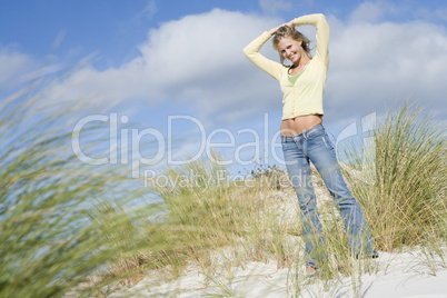 Young woman amongst dunes