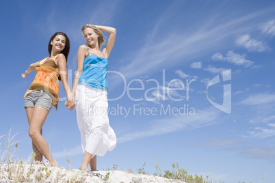 Two young women relaxing at beach