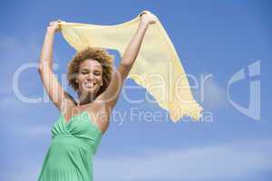 Young woman holding scarf