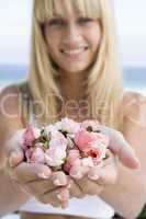 Woman holding handful of flower buds