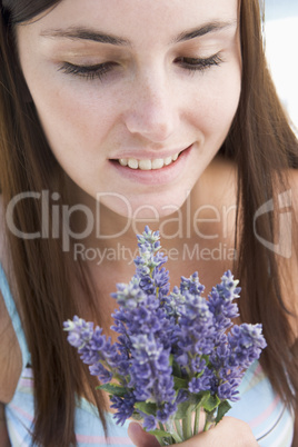 Woman looking at wild flowers