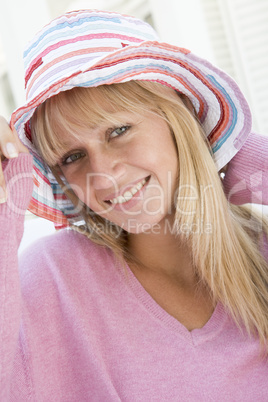 Young woman wearing straw hat