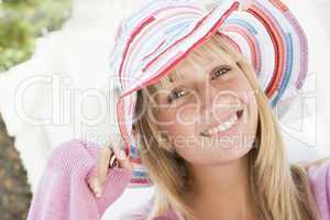 Young woman wearing straw hat