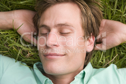 Man lying on grass sleeping