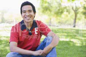 Man sitting outdoors smiling