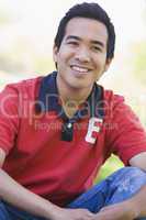 Man sitting outdoors smiling