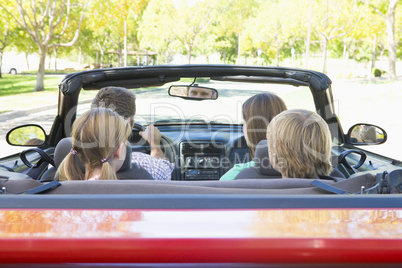 Family in convertible car