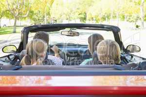 Family in convertible car