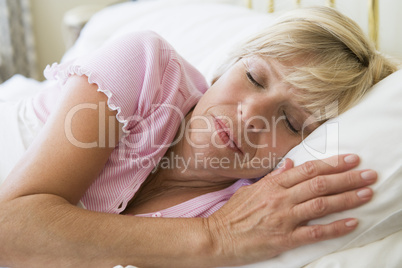 Woman lying in bed sleeping