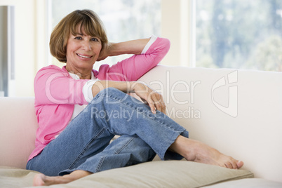 Woman in living room smiling