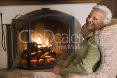 Woman in living room laughing