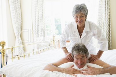 Man receiving a massage from a woman