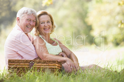 Couple at a picnic smiling