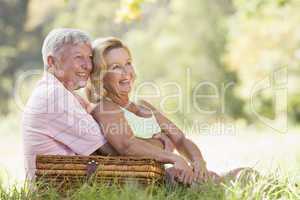Couple at a picnic smiling