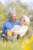 Couple relaxing outdoors smiling