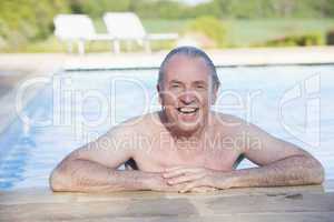 Man in outdoor pool smiling
