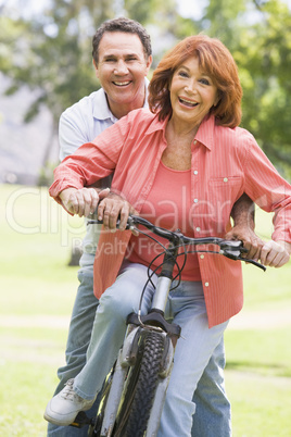Mature couple bike riding.