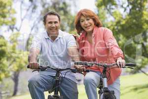 Mature couple bike riding.