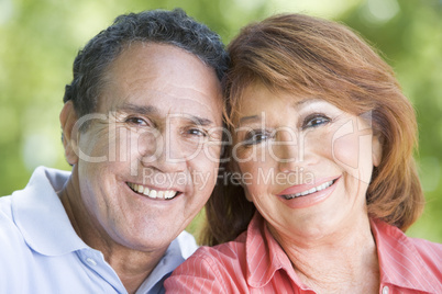 Couple outdoors smiling