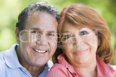 Couple outdoors smiling