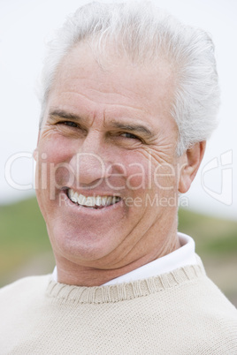 Man at the beach smiling