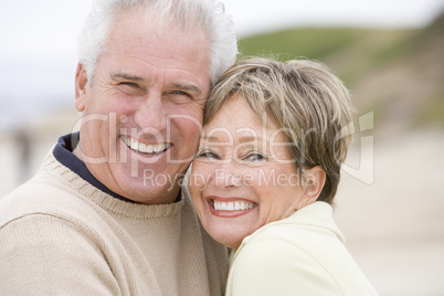 Couple at the beach smiling