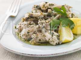 Frogs Legs Fried in Garlic and Herb Butter with Lemon