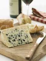 Wedge of Roquefort Cheese with Rustic Baguette and Red Wine